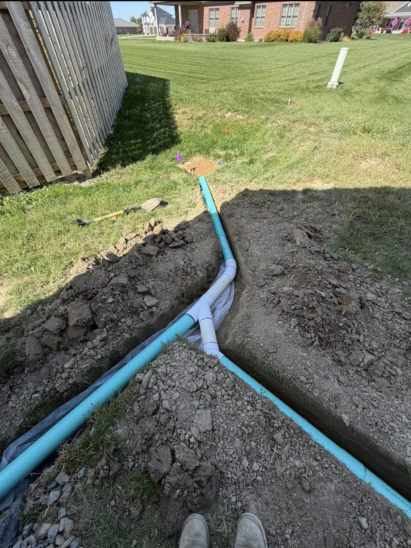 Trench and drainage pipe installation